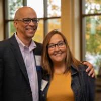 Chris Barbee '88 posing for a photo with an alum.